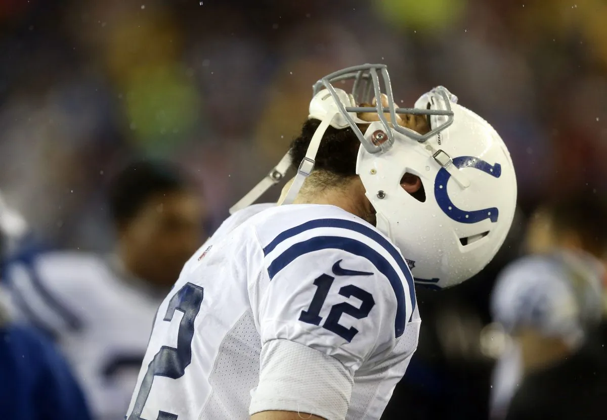 Indianapolis Colts quarterback Andrew Luck throws his head back after throwing and interception during the second half of the NFL football AFC Championship game against the New England Patriots Sunday, Jan. 18, 2015, in Foxborough, Mass. (AP Photo/Julio Cortez)