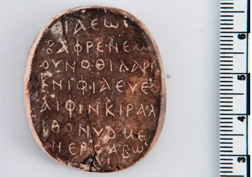 The amulet with the palindrome inscription found in Cyprus. (Marcin Iwan, artifact from the excavations of Jagiellonian University in Krakow at Paphos Agora)