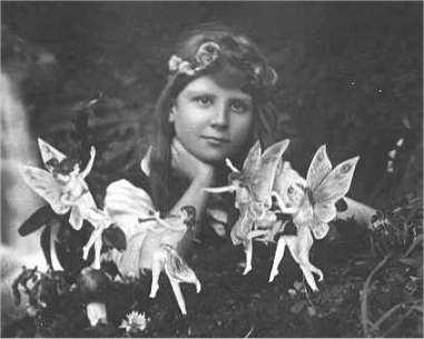 The first of the five photographs, taken by Elsie Wright in 1917, shows Frances Griffiths with the alleged fairies. (Public Domain)