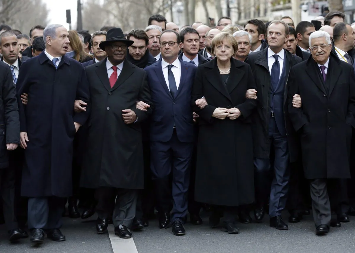 French President François Hollande (3rd L) is surrounded by head of states—(L–R) Benyamin Netanyahu of Israel, Ibrahim Boubacar Keita of Mali, Angela Merkel of Germany, EU Coucil President Donald Tusk, and Palestinian Mahmud Abbas—as they attend the solidarity march in the streets of Paris on Jan. 11, 2015. (Philippe Wojazer/AFP/Getty Images)