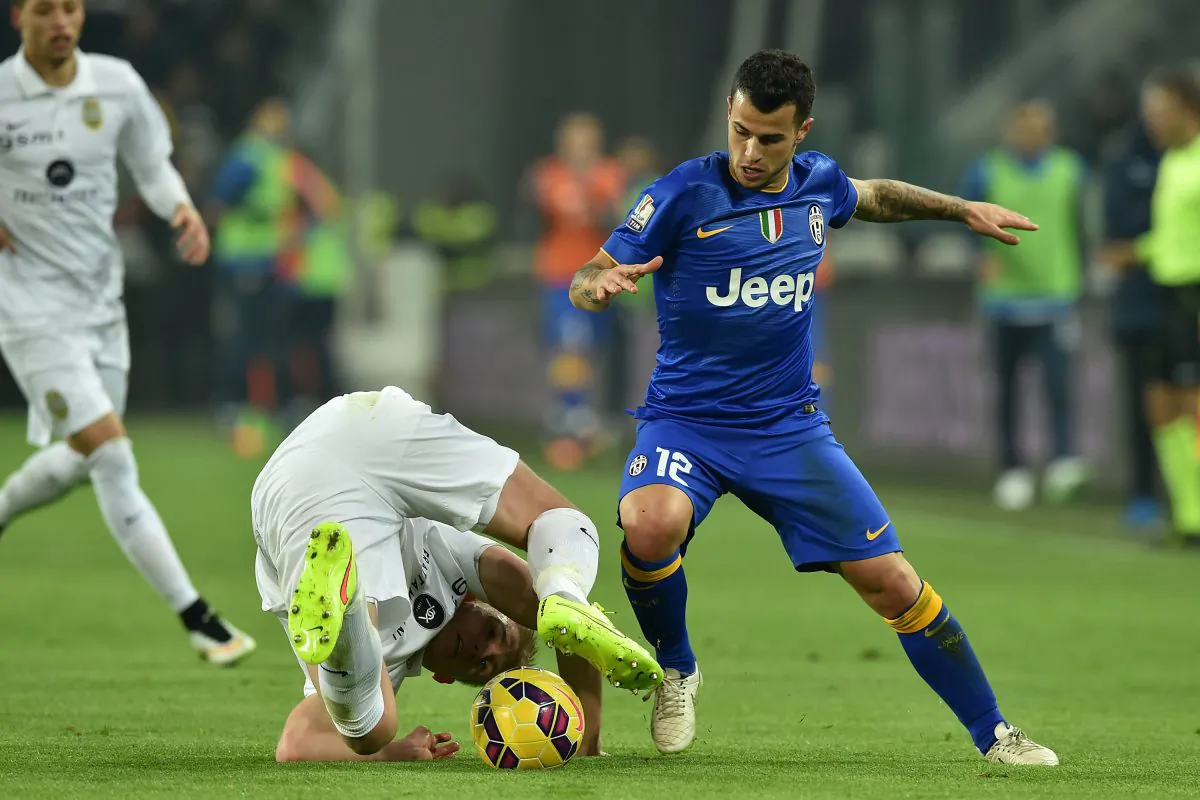 Sebastian Giovinco (R) tackles Frederik Sorensen during an Italian Cup match between Juventus and Hellas Verona on Jan. 15 in Turin, Italy. Giovinco is Toronto FC’s latest big-name signing after the announcement on Monday, Jan. 19, 2015 in Toronto from general manager Tim Bezbatchenko. (Valerio Pennicino/Getty Images)
