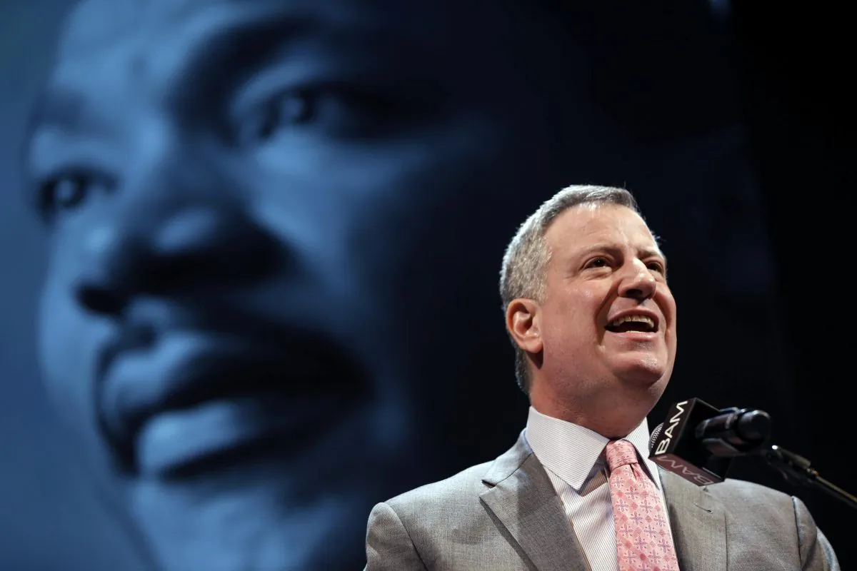 New York City Mayor Bill de Blasio speaks at a tribute to Martin Luther King, Jr. in Brooklyn, New York City, Monday, Jan. 20, 2014. At a separate Dr. King celebration in Manhattan on Monday, De Blasio invoked Dr. King's words to call for unity amid tensions between police and local residents. (AP Photo/Seth Wenig)