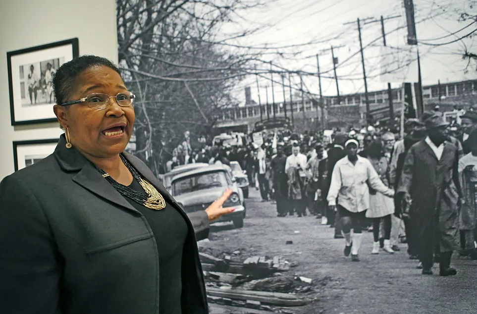 Lynda Blackmon Lowery in front of a Stephen Somerstein photograph showing the 1965 march from Selma to Montgomery, Ala., during a pre-Martin Luther King Day appearance at the New-York Historical Society in New York on Sunday, Jan. 18, 2015. (AP Photo/Kathy Willens)