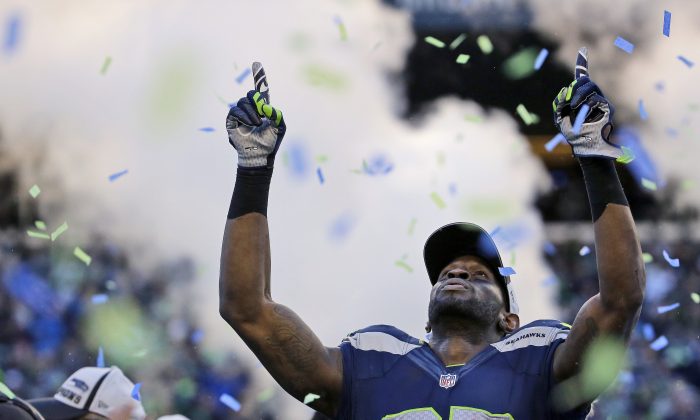 Seattle Seahawks' Ricardo Lockette celebrates after during overtime of the NFL football NFC Championship game against the Green Bay Packers Sunday, Jan. 18, 2015, in Seattle. The Seahawks won 28-22 to advance to Super Bowl XLIX. (AP Photo/Ted S. Warren)
