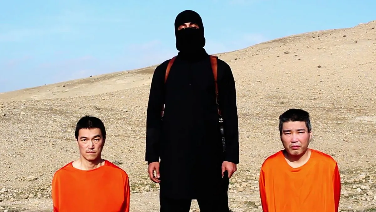 This image taken from an online video released by the Islamic State group's al-Furqan media arm on Tuesday, Jan. 20, 2015, purports to show the group threatening to kill two Japanese hostages that the militants identify as Kenji Goto Jogo, left, and Haruna Yukawa, right, unless a $200 million ransom is paid within 72 hours. Japan's Foreign Ministry's anti-terrorism section has seen the video and analysts are assessing it, a ministry official said on Tuesday. (AP Photo) 