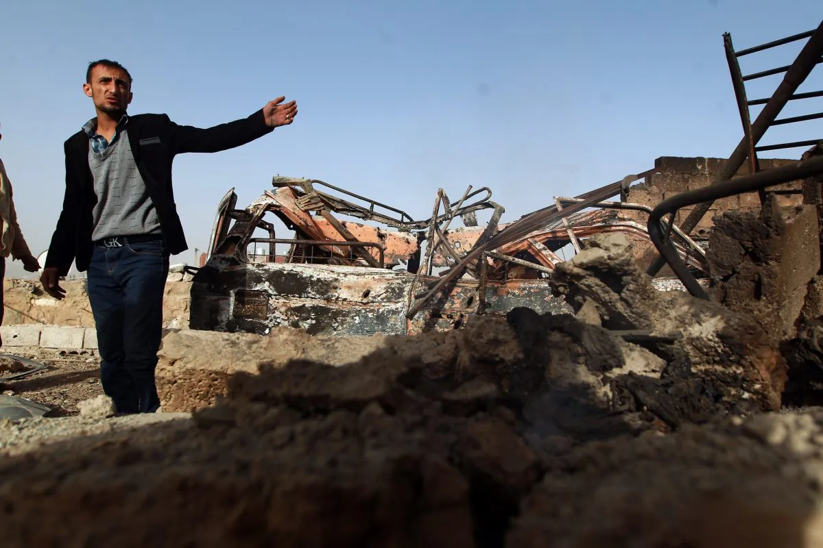 A Yemeni man inspects the damage near the presidential palace in Sanaa on Jan. 20, 2015, following fierce clashes between Huthi militiamen and the presidential guard the previous day. (Mohammed Huwais/AFP/Getty Images)
