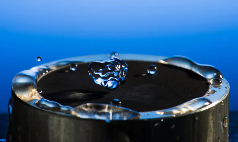 University of Rochester has developed a technique that uses lasers to render materials hydrophobic, illustrated in these images taken in his lab. (J. Adam Fenster/University of Rochester)