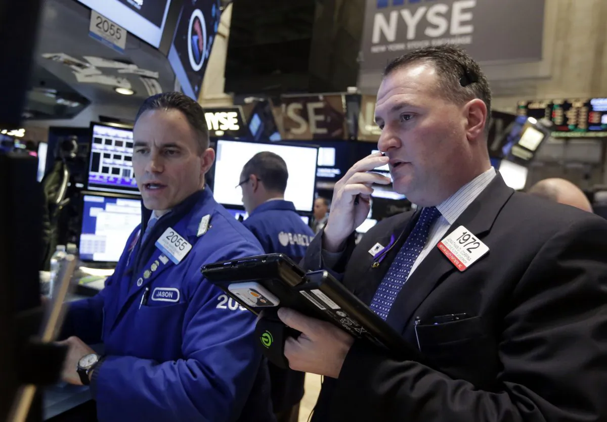 Specialist Jason Hardzewicz (L) and trader Jonathan Corpina worknon the floor of the New York Stock Exchange Wednesday, Jan. 21, 2015. The U.S. stock market is mixed in early trading after two straight days of gains. (AP Photo/Richard Drew)