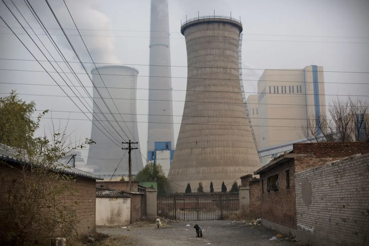 Smoke billows from a coal-fired power plant in Beijing, China on Nov. 19. 2014. (Kevin Frayer/Getty Images)