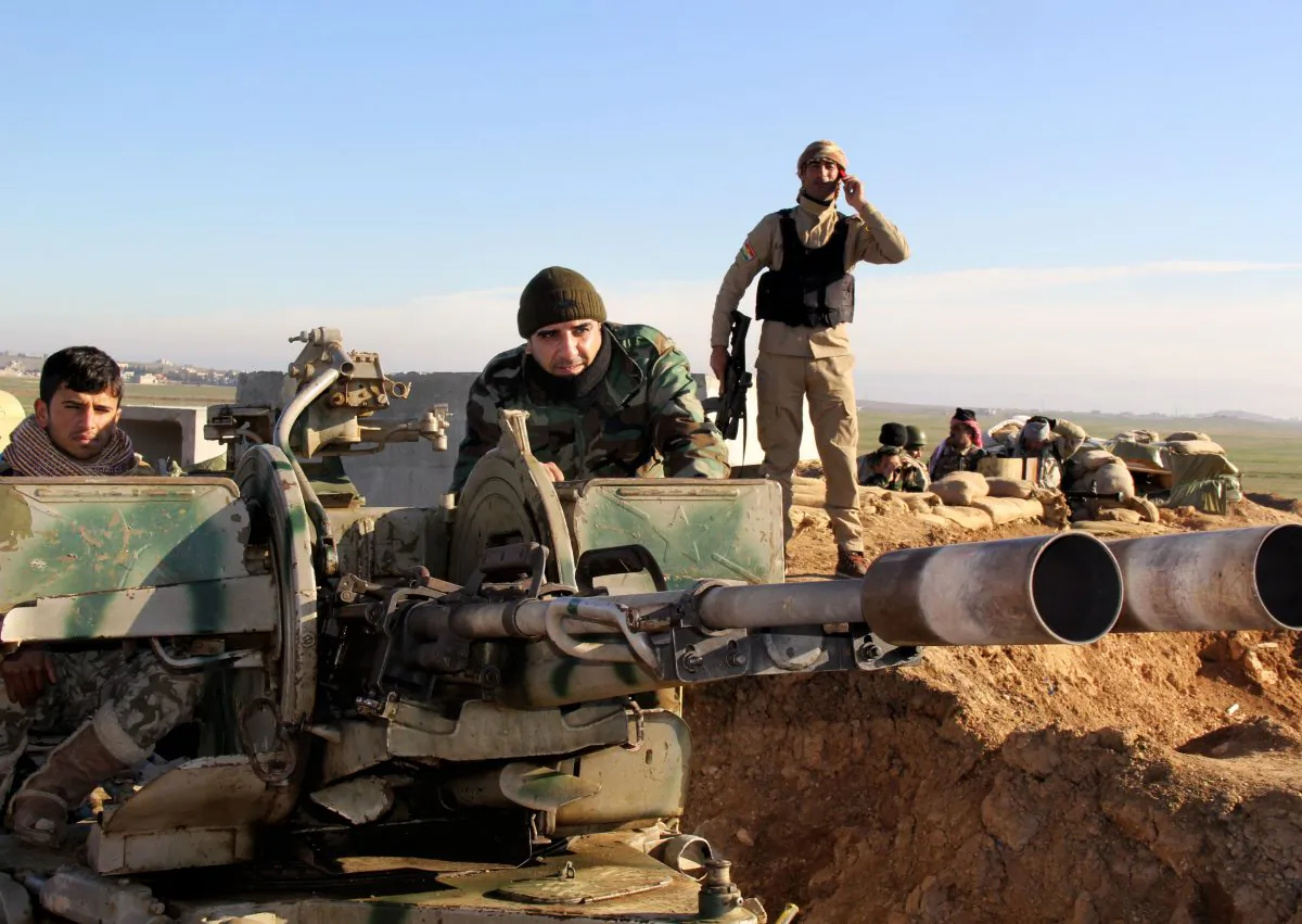 Kurdish peshmerga forces prepare their positions on the front line for battle against Islamic State group positions in northern Iraq on Jan. 20, 2015. Kurdish Regional Security Council said Wednesday, Jan. 21, 2015, that Kurdish peshmerga fighters launched a new offensive to secure areas southeast and southwest of the dam. (AP Photo/Kurdistan Region Security Council)
