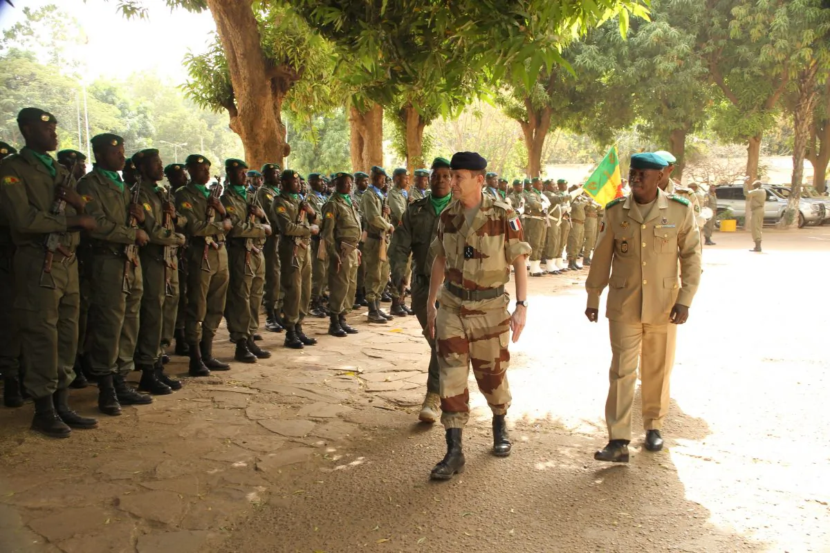 Malian Army Chief of Staff General Mahamane Toure (R) and French Army Chief of Staff, General Pierre de Villiers (C) review troops upon de Villiers' arrival for his meeting with Toure at the Defense ministry in Bamako, Mali, on February 27, 2014. France and Germany sent troops to Mali in its first deployment to Africa, as Mali was thrown into chaos in 2012 when Tuareg separatist rebels launched an offensive in the northern desert helped by Islamist militants linked to Al-Qaeda, after the country's president was toppled in a coup. (Abibou Kouyate/AFP/Getty Images)