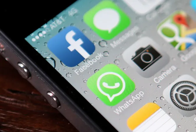 The Facebook and WhatsApp app icons are displayed on an iPhone in San Francisco, California on Feb. 19, 2014.  (Justin Sullivan/Getty Images)