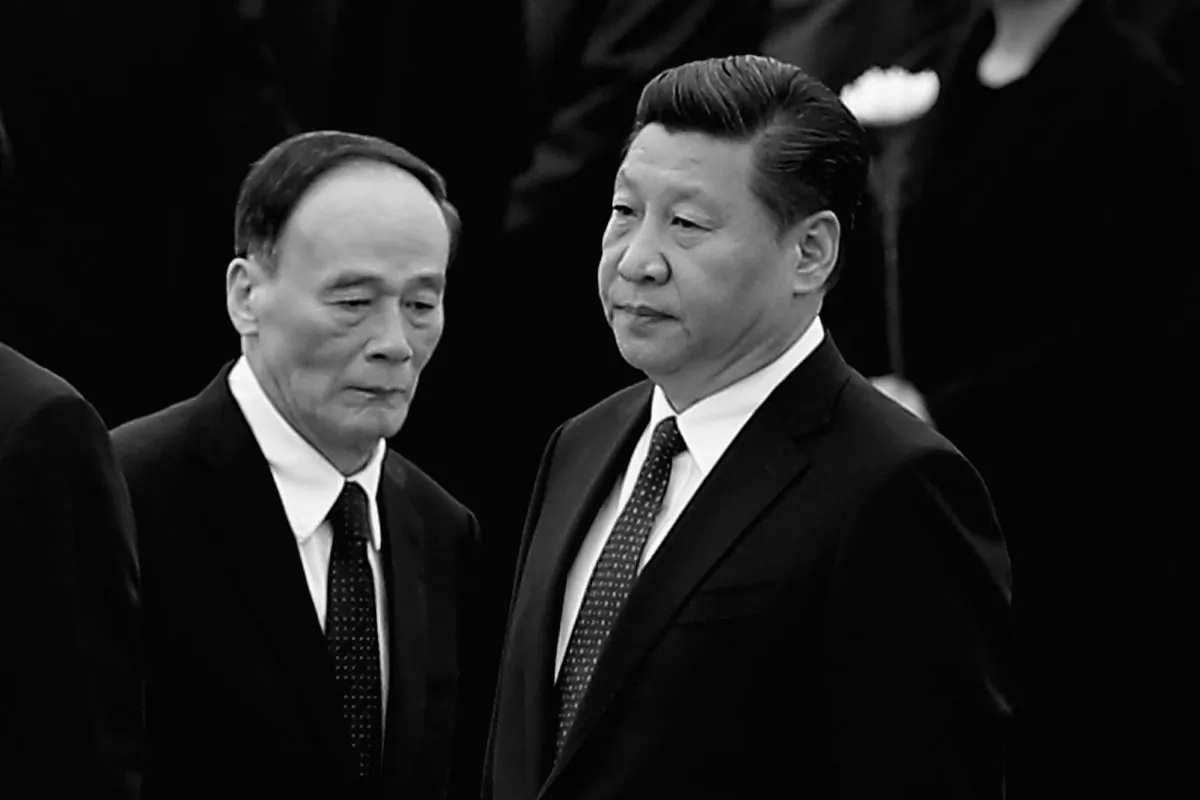 In this file photo, Chinese Communist Party head Xi Jinping (R) stands with Secretary of the Central Commission for Discipline Inspection Wang Qishan (L), on Sept. 30, 2014 in Beijing, China. Over the past two years Wang has carried out an unprecedented anti-corruption campaign on behalf of Xi. (Feng Li/Getty Images) 