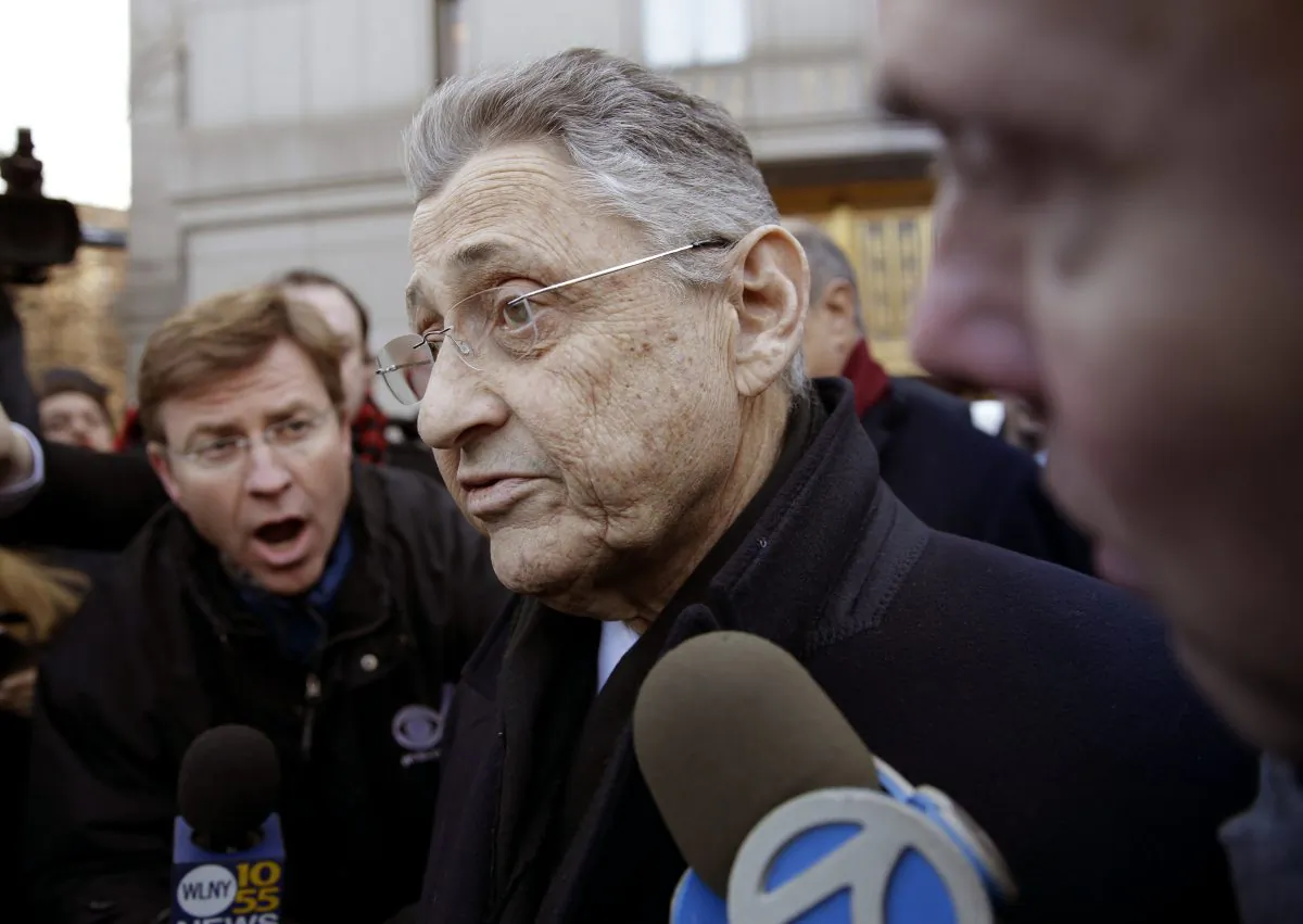 New York State Assembly Speaker Sheldon Silver is surrounded by media as he leaves a federal courthouse in New York, Thursday, Jan. 22, 2015. Silver, 70, was arrested Thursday on public corruption charges and accused of using his position to obtain millions of dollars in bribes and kickbacks, masked as legitimate income. (AP Photo/Seth Wenig)