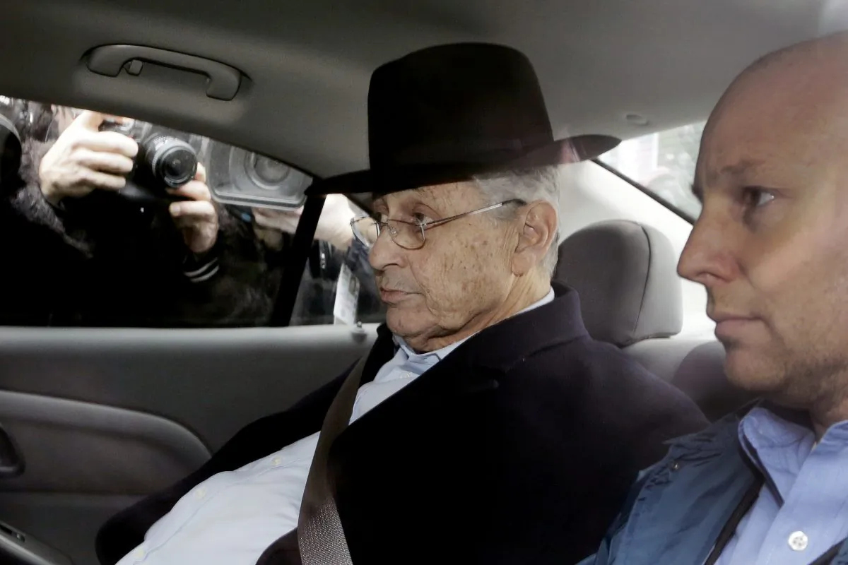New York Assembly Speaker Sheldon Silver, center, is driven by federal agents to federal court, Thursday, Jan. 22, 2015 in New York. Silver, who has been one of the most powerful men in Albany for more than two decades, was arrested Thursday on public corruption charges. (Mark Lennihan/AP Photo)