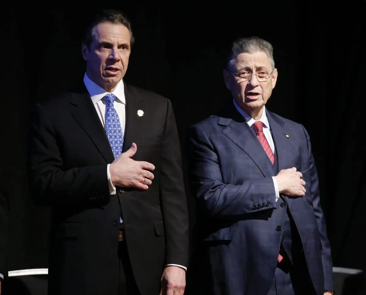 Assembly Speaker Sheldon Silver (D-Manhattan) (R) stands with New York Gov. Andrew Cuomo before Cuomo's State of the State address and executive budget proposal at the Empire State Plaza Convention Center in Albany, N.Y., on Jan. 21, 2015. Silver, who has been one of the most powerful men in Albany for more than two decades, was arrested Thursday on public corruption charges. (AP Photo/Mike Groll)