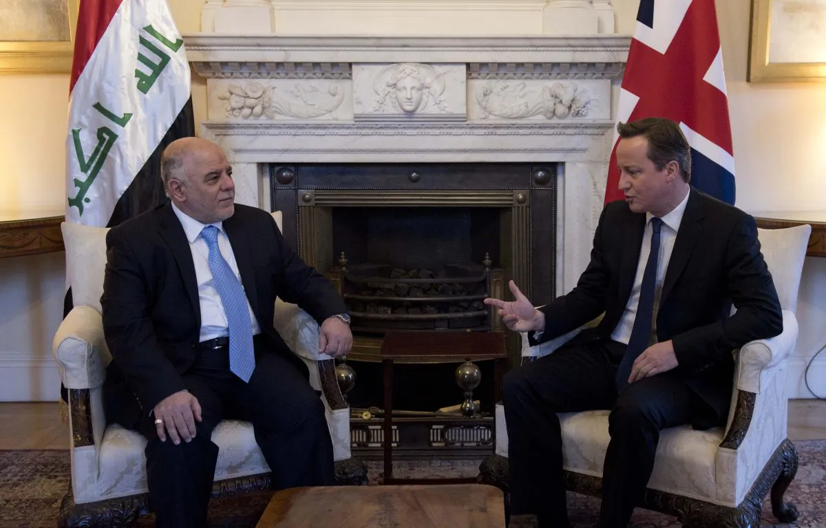 British Prime Minister David Cameron (R) speaks with Iraqi Prime Minister Haider al-Abadi (L), as they meet at 10 Downing Street, London, Thursday, Jan. 22 2015. Al-Abadi is in London to attend a meeting Thursday on the country's beleaguered efforts to combat Islamic State. (AP Photo/Will Oliver)