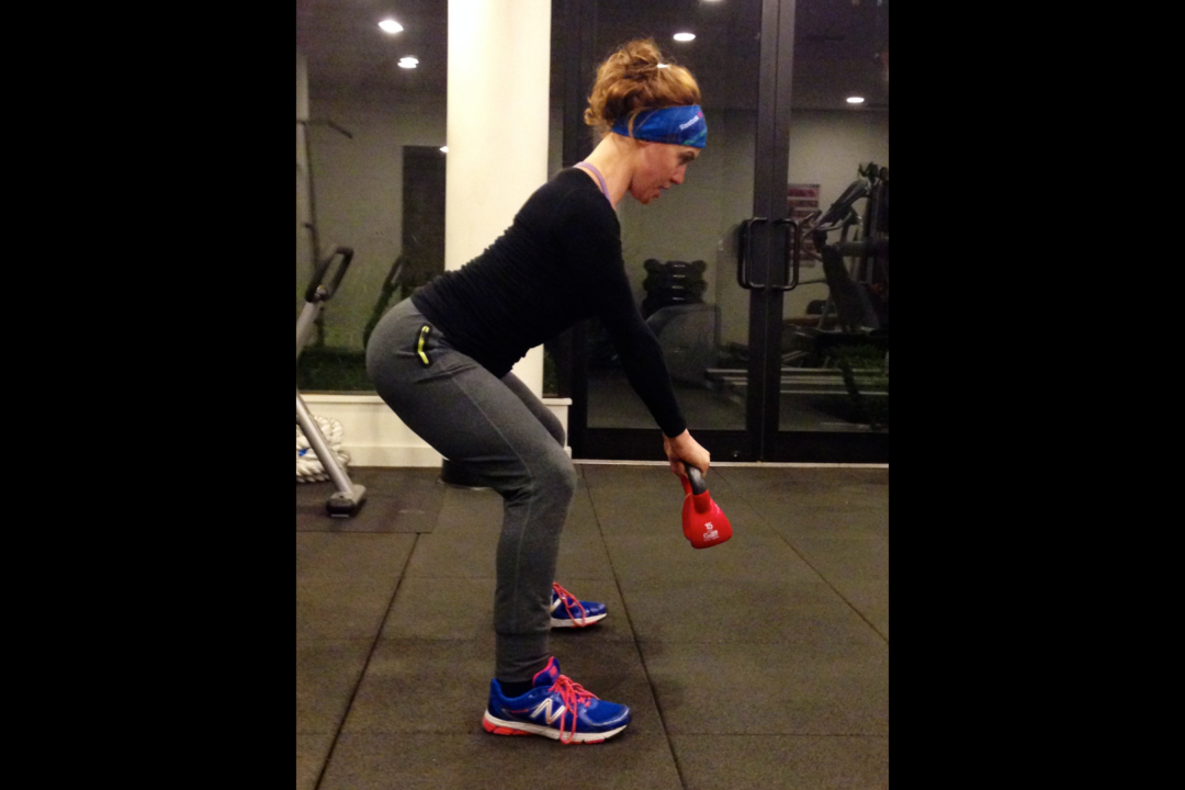 In addition to its fat-burning benefits, the kettlebell swing can help extend your posture and even reduce back pain by increasing stability in your lower back. (Courtesy of Ashely Whitson)