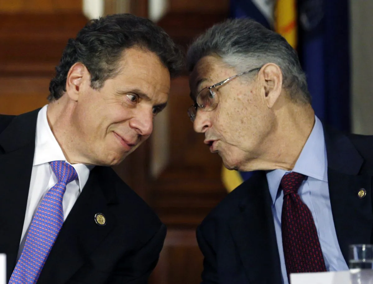 In this June 19, 2014 file photo, New York Gov. Andrew Cuomo, left, and Assembly Speaker Sheldon Silver, D-Manhattan, talk during a news conference announcing an agreement on legislation legalizing medical marijuana in Albany, N.Y.  Silver was charged by federal prosecutors on Thursday on corruption and bribery charges. (AP Photo/Mike Groll, File)