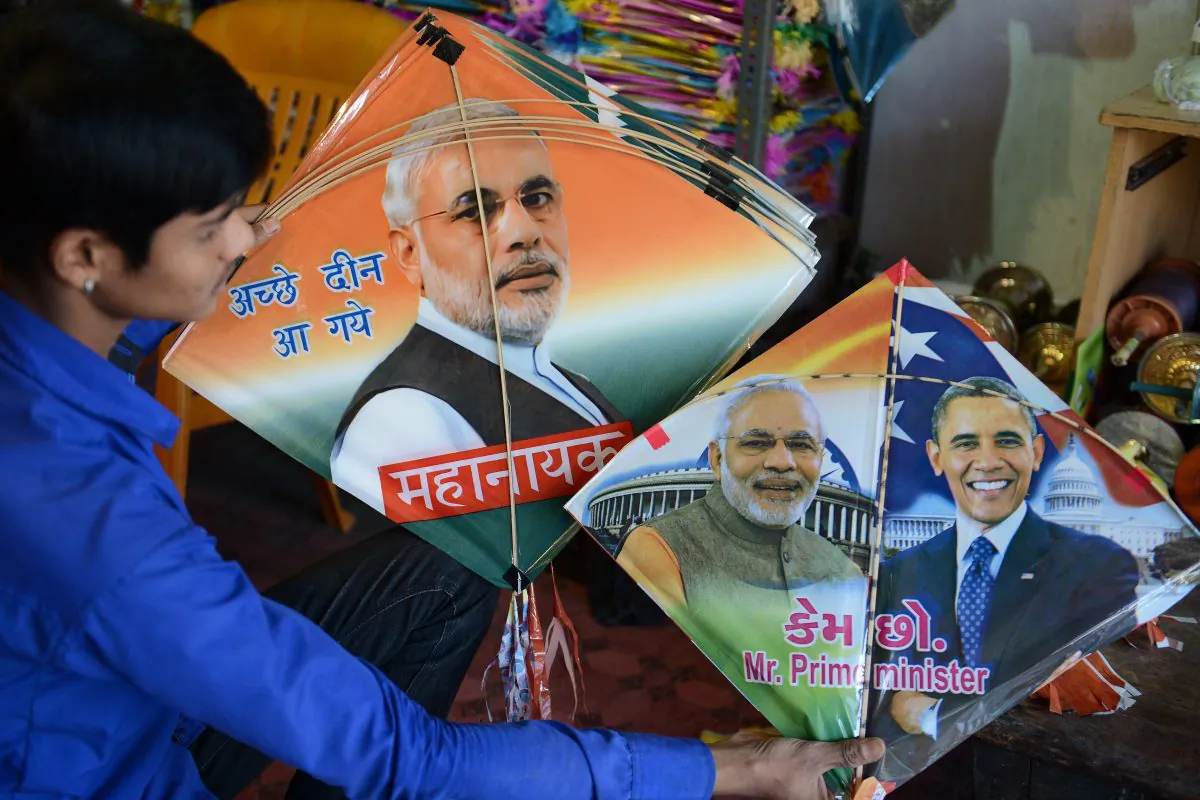 An Indian vendor in Hyderabad, on Jan. 7, 2015, displays kites printed with the portraits of Prime Minister Narendra Modi and U.S. President Barack Obama, who is expected to visit India for the forthcoming Republic Day celebrations, ahead of the forthcoming Makar Sankranti kite festival. (Noah Seelam/AFP/Getty Images)