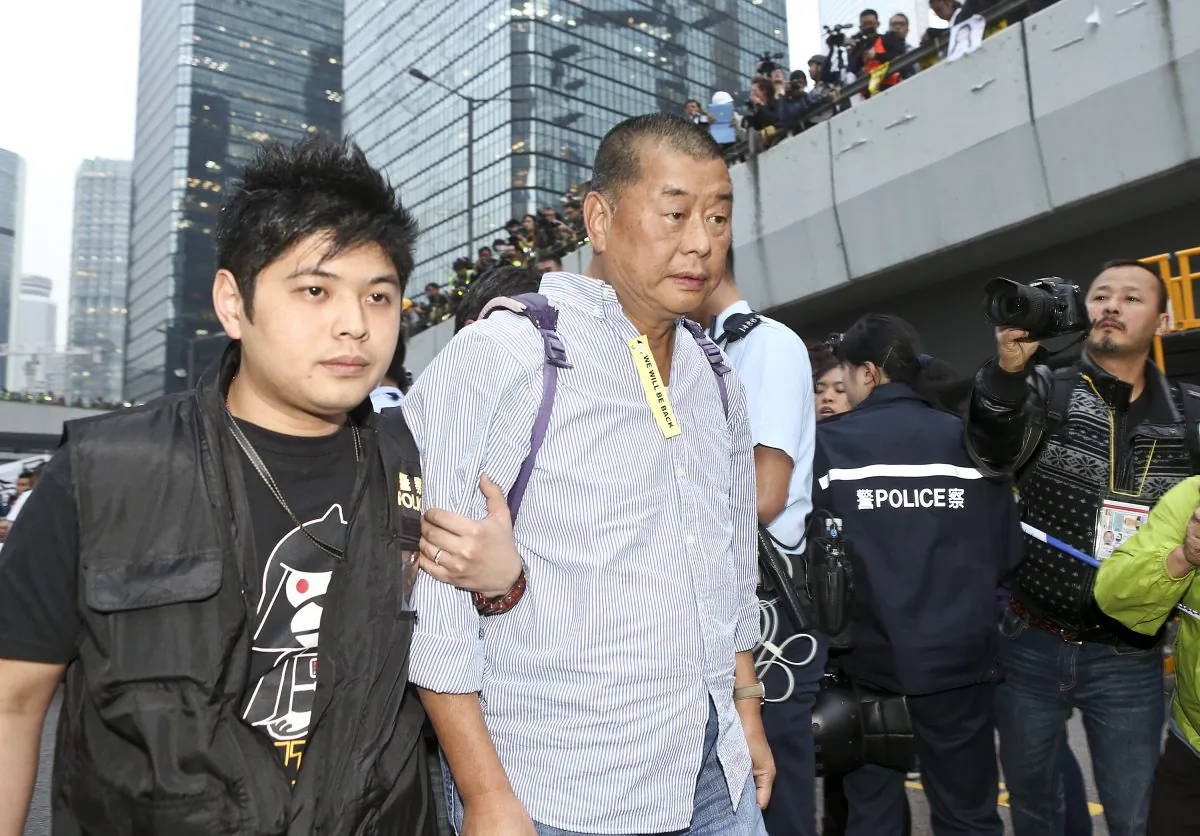 Hong Kong media tycoon Jimmy Lai on Dec. 11, 2014. His mansion and the Next Media building were firebombed on Jan. 12, 2015, and Hong Kong people are concerned the attacks were connected to the Chinese regime. (Yu Kong/Epoch Times)