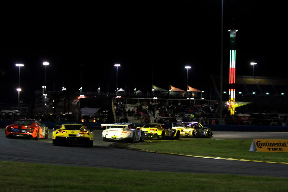 The GTLM battle squeezes through GTD traffic: (L-R) #45 GTD Flying lizard Audi, #4 GTLM Corvette, #911 GTLM Porsche, #3 GTLM Corvette, #81 GB Autosport GTD Porsche. (Chris Jasurek/Epoch Times)