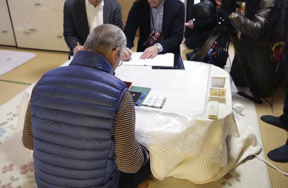 Shoichi Yukawa, father of Haruna Yukawa, one of two Japanese hostages held by the Islamic State group, speaks during an interview at his home in Chiba, near Tokyo Sunday, Jan. 25, 2015. Japanese officials are working to verifying a new message purported to be from the Islamic State group holding the hostages. The Associated Press could not verify the contents of the message, which varied greatly from previous videos released by the Islamic State group, which now holds a third of both Syria and Iraq. (AP Photo/Asahi Shimbun, Yasuhiro Sugimoto, Pool)