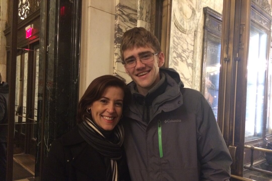 Jessica Rodriguez, vice president of content acquisition at Netflix, with her son Eric, a student of aerospace engineering at the Massachusetts Institute of Technology, after seeing Shen Yun Performing Arts at the Boston Opera House, on Jan. 25, 2015, in Boston, Mass. (Hua Cheng/Epoch Times)