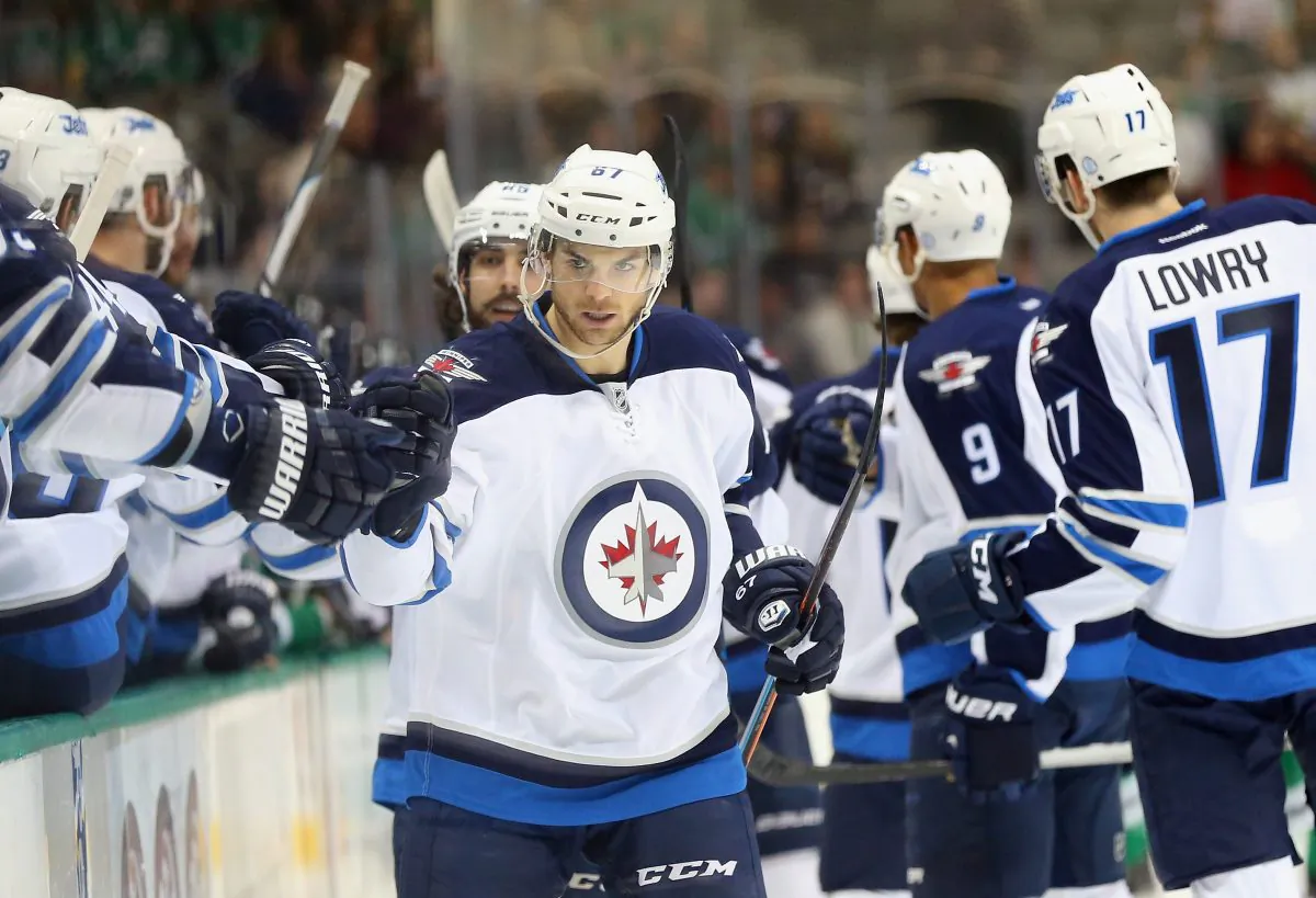 Michael Frolik celebrates his goal against the Dallas Stars at American Airlines Center on Jan. 15, 2015 in Dallas, Texas. The Winnipeg Jets play in the toughest division in the NHL and are on pace to make the playoffs. (Ronald Martinez/Getty) 