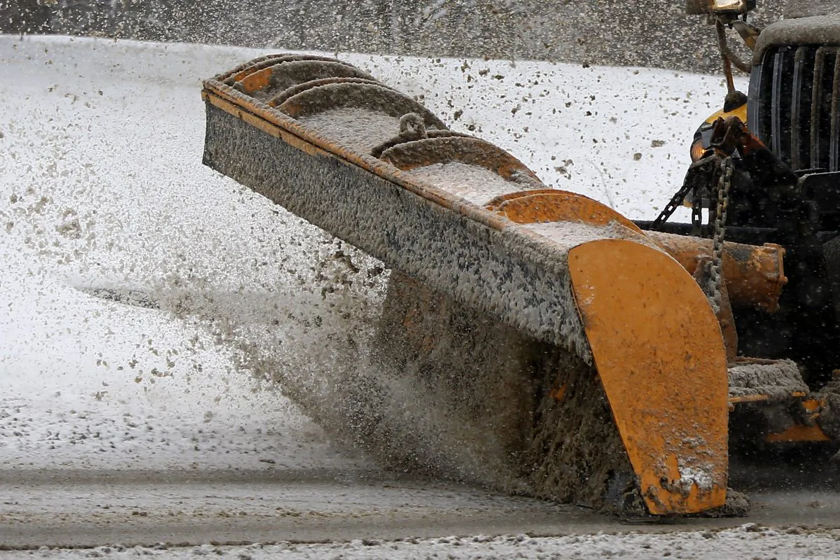 A Pennsylvania Department of Transportation truck plows snow from an overpass on Monday, Jan. 26, 2015, in Evans City, Pa. Over three inches of snow had already fallen and more is on the way as the storm moves across the northeast of the country. (AP Photo/Keith Srakocic)
