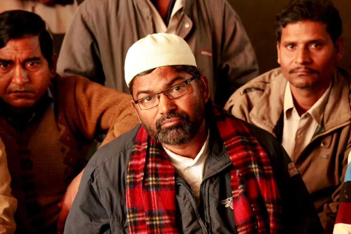 Iattar Hussain, a street vendor who sells old clothes and old leather jackets, attends a meeting of the street vendors and hawkers of Delhi on Jan. 6, 2015. Hussain was a one of 500 vendors who protested Walmart's expansion outside of the company's corporate offices in Gurgaon city of Delhi on Nov. 19, 2014. (Venus Upadhayaya/Epoch Times)