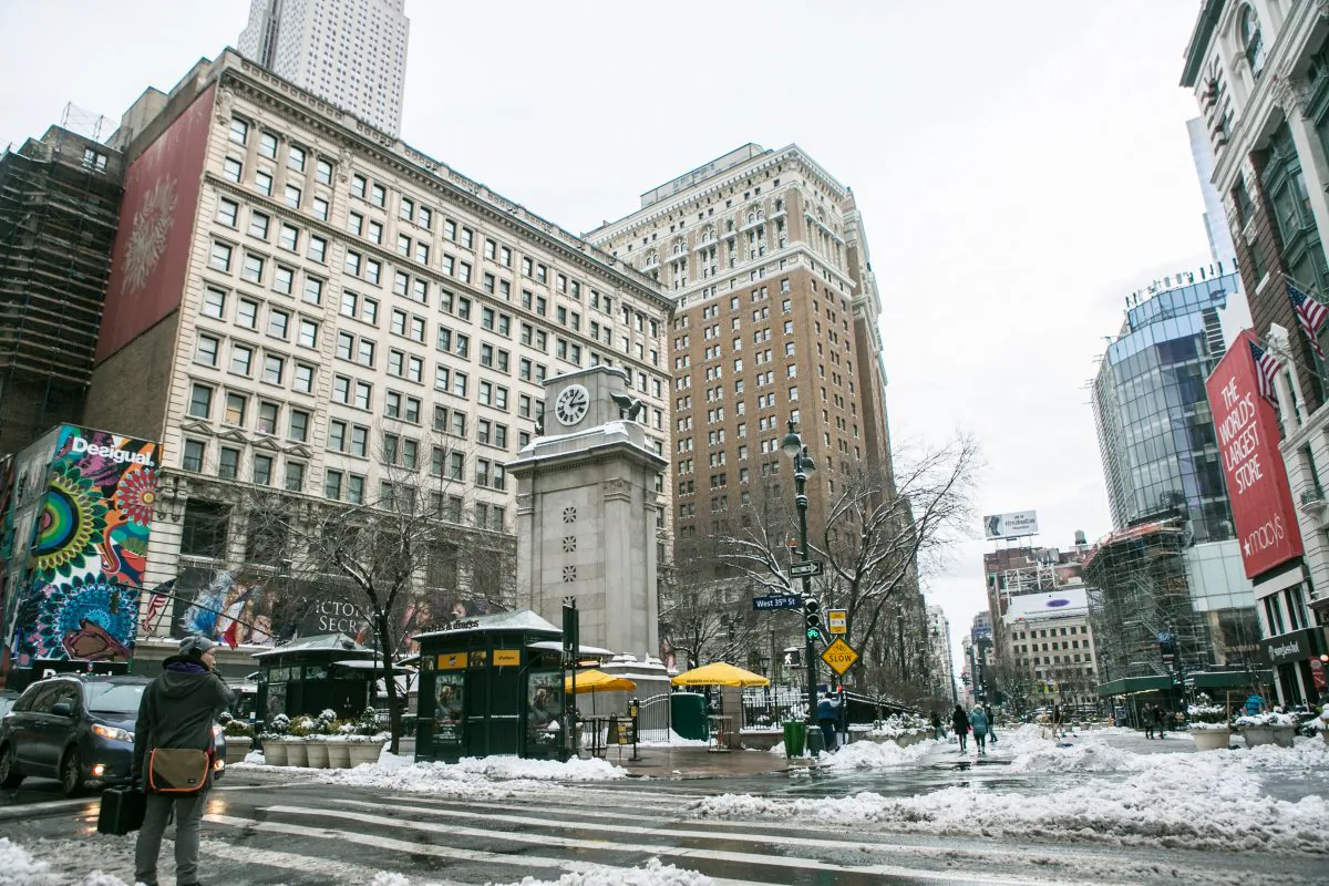 People walk in Harold Square after the blizzard in New York City on Jan. 27, 2015. (Benjamin Chasteen/Epoch Times)