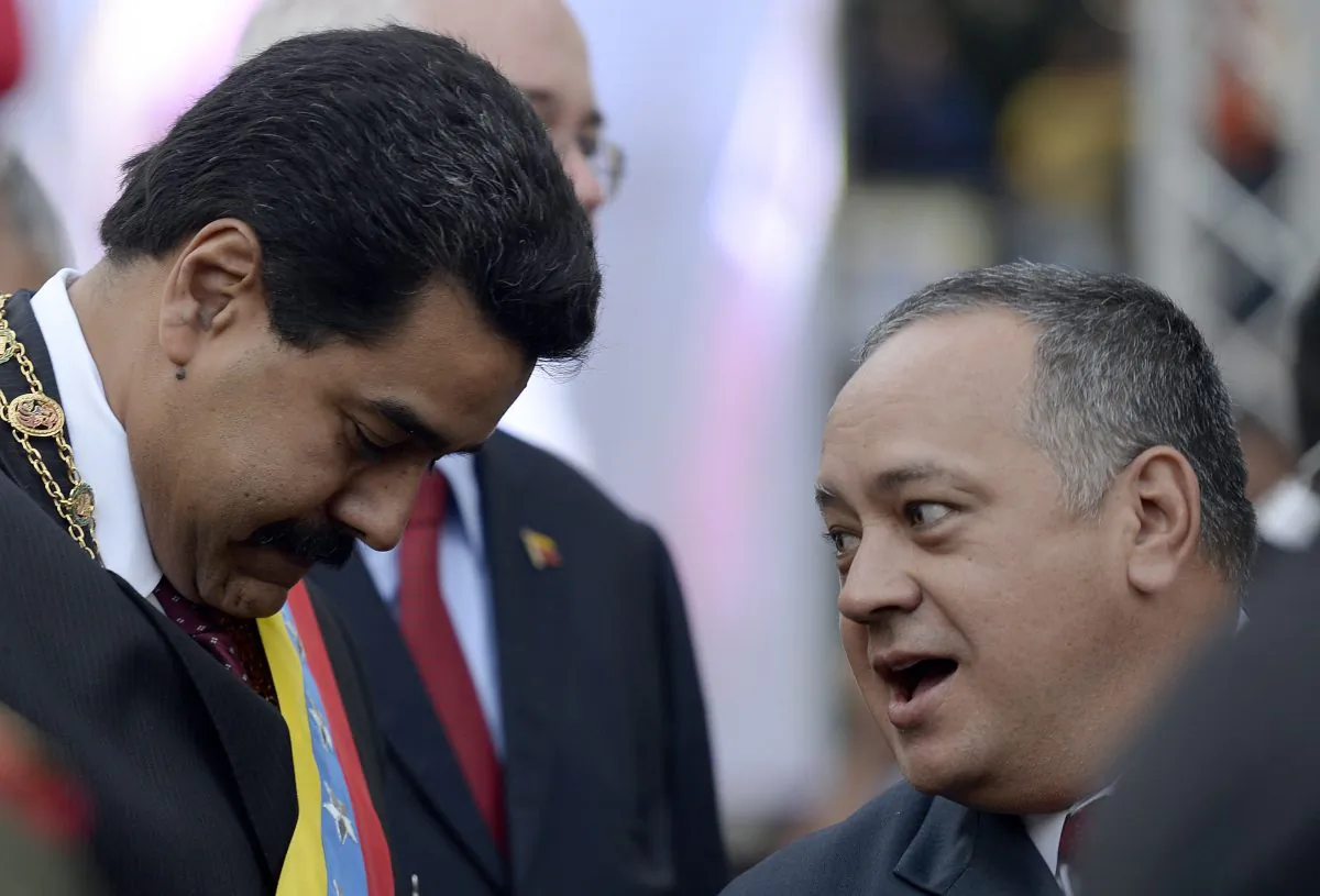 Venezuelan President Nicolas Maduro (L) talks with then president of the Venezuelan Parliament, Diosdado Cabello (R) in Caracas on Jan. 15, 2014. Cabello is allegedly in charge of a leading drug cartel. (Juan Barreto/AFP/Getty Images)