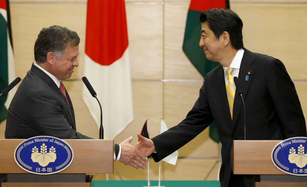 Jordan's King Abdullah II (L) and Japanese Prime Minister Shinzo during a  press conference in Tokyo on Nov. 20, 2014.  (Shizuo Kambayashi/AFP/Getty Images)