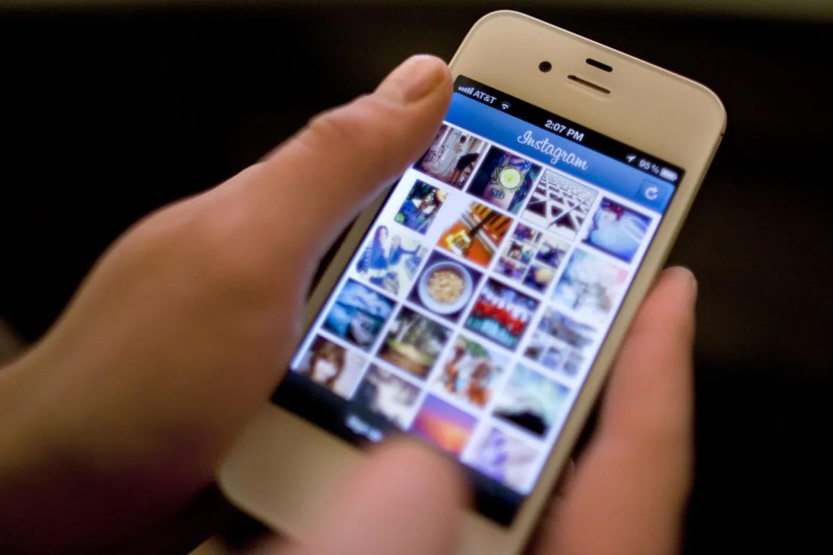 A 2012 file photo of an iPhone. Apple reported record Q1 2015 earnings, driven by sales of its iPhone. (AP Photo/Karly Domb Sadof, File)