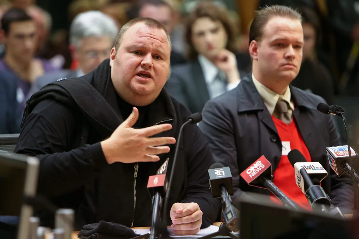 Kim Dotcom speaks while Bram van der Kolk looks on during an Intelligence and Security Committee hearing at Bowen House on July 3, 2013 in Wellington, New Zealand. Mr. Dotcom challenged the Prime Minister to meet ahead of Security and Intelligence talks. Mr. Dotcom believes the new bill is wrong. (Hagen Hopkins/Getty Images)