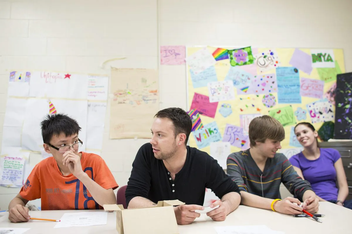 WiseGuyz creator Blake Spence (C) leads a session with grade nine boys. WiseGuyz aims to address a gender gap in sexual health programs by offering education and support to young men. (Courtesy of WiseGuyz)