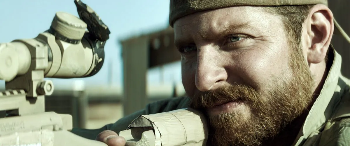 In this image released by Warner Bros. Pictures, Bradley Cooper portrays Navy SEAL Chris Kyle in a scene from "American Sniper." Former Navy SEAL and Minnesota Gov. Jesse Ventura, who won $1.8 million in a defamation lawsuit last year against the estate of the late Chris Kyle, says he won’t see the film partly because Kyle is no hero to him. He tells The Associated Press a hero must be honorable, and there’ no honor in lying. Lyle claimed in his “American Sniper” book that he punched out a man, whom he later identified as Ventura, at a California bar in 2006 for allegedly saying the SEALs "deserve to lose a few" in Iraq. Ventura said it never happened. (AP Photo/Warner Bros. Pictures)