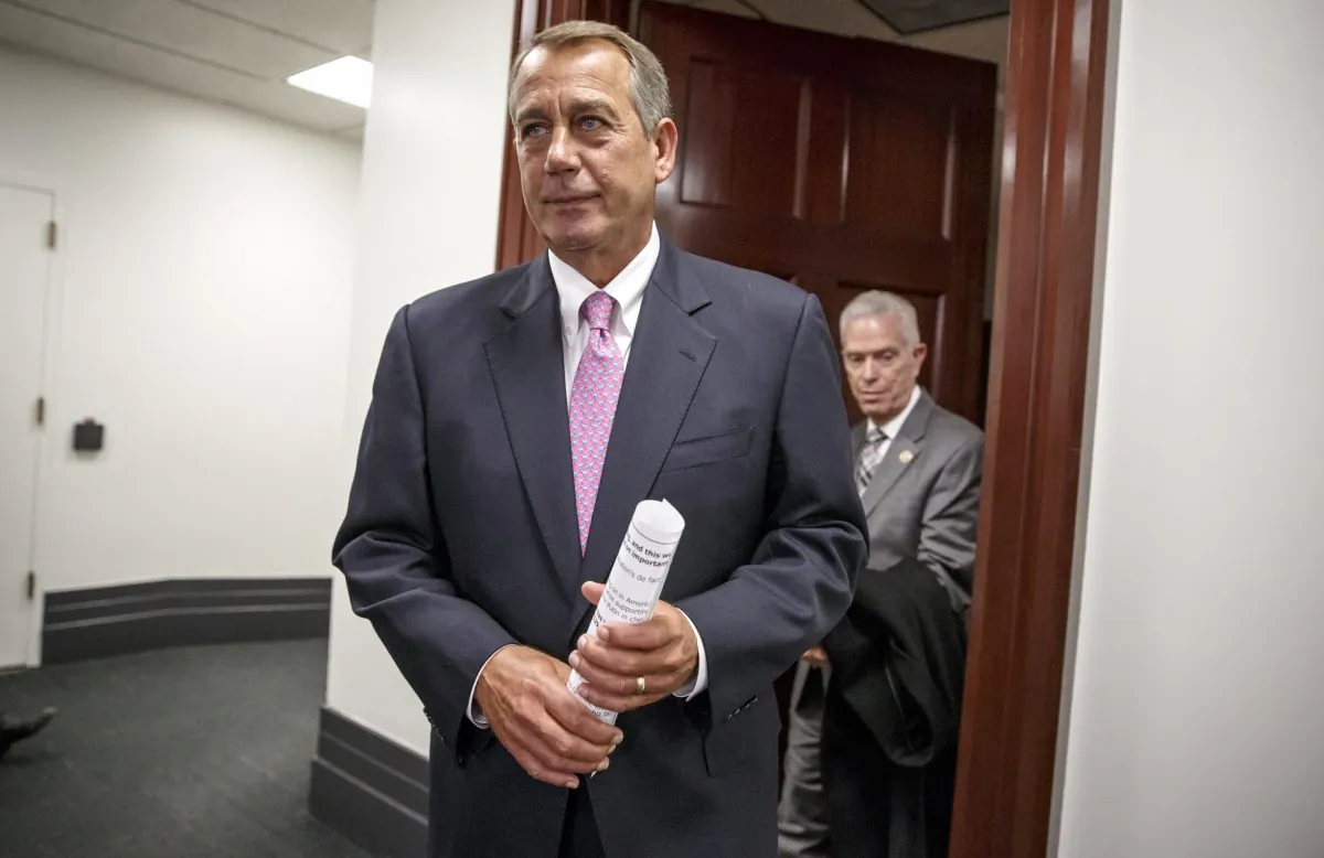 House Speaker John Boehner of Ohio, followed by Rep. Bill Johnson, R-Ohio, emerges from a closed-door strategy session with House Republicans, on Capitol Hill in Washington, Tuesday, Jan. 27, 2015. (AP Photo/J. Scott Applewhite)