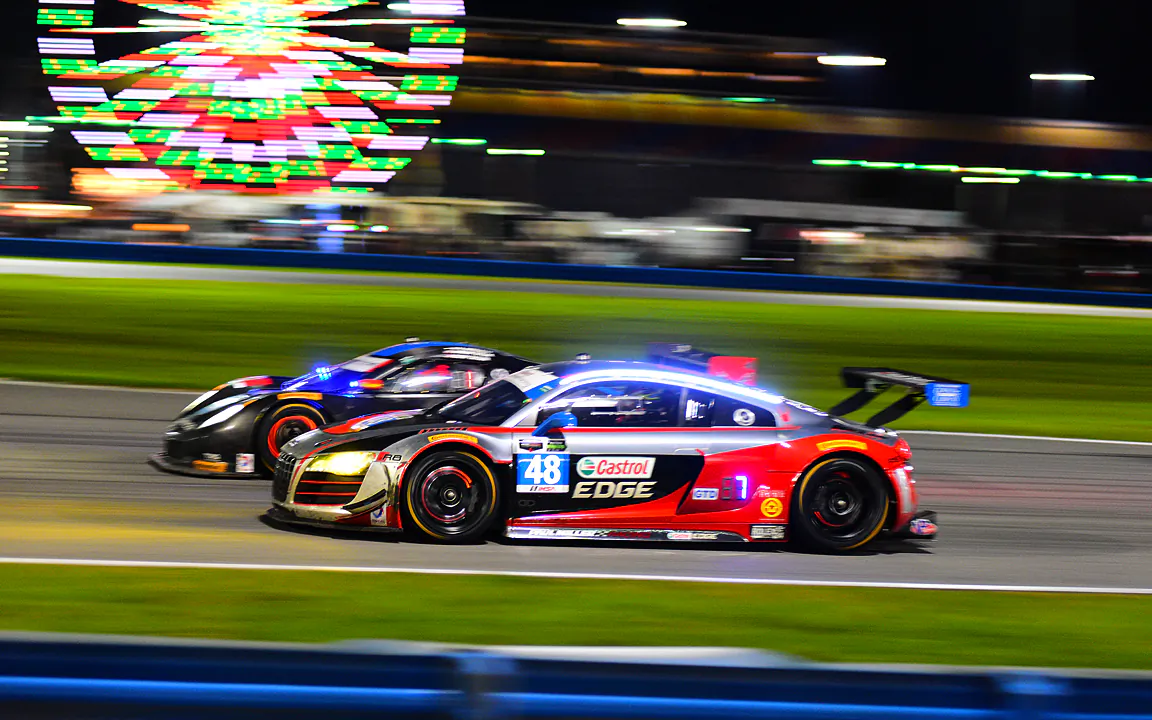 The #10 WTR Dallara-Corvette cuts inside the #49 Miller Racing Audi entering the East Horseshoe. (Courtesy Bill Kent/No Sweat Photography)