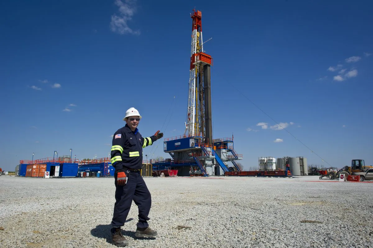 Jeff Boggs, responsible for the drilling at Consol Energy poses, in front of one of the company’s horizontal gas drilling rigs exploring the Marcellus Shale outside the town of Waynesburg, Pa., on April 13, 2012. (Mladen Antonov/AFP/Getty Images)