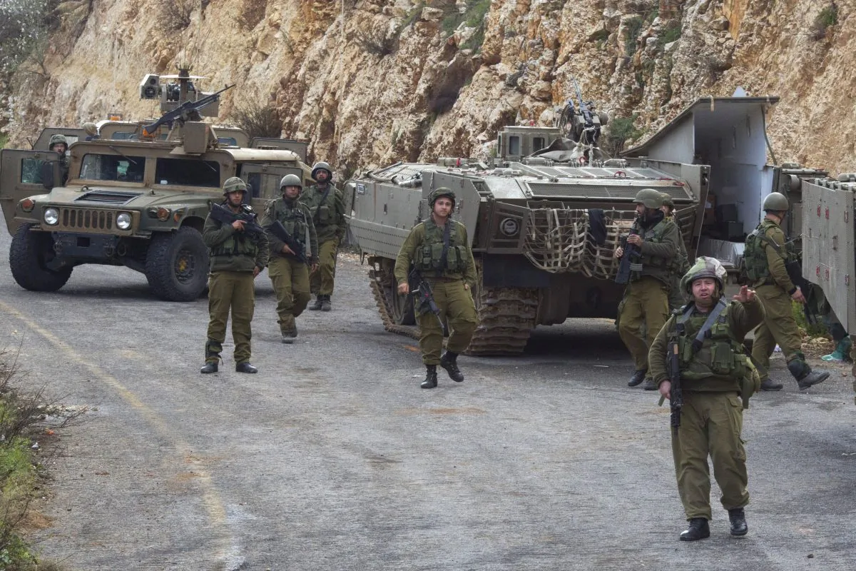 Israeli soldiers secure the Israel-Lebanon border, Wednesday, Jan. 28, 2015. (AP Photo/Ariel Schalit)