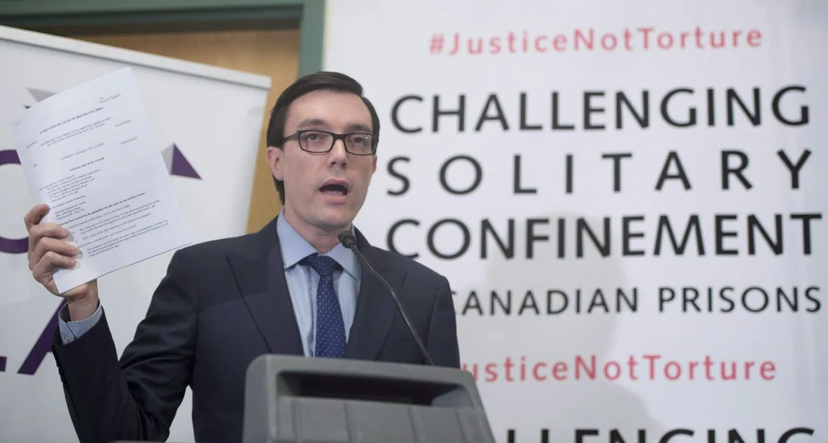 Josh Paterson of the British Columbia Civil Liberties Association addresses a news conference in Vancouver on Jan. 19, 2015. The BCCLA and the John Howard Society have filed a lawsuit against the Attorney General of Canada regarding the use of solitary confinement in prisons. (The Canadian Press/Jonathan Hayward)