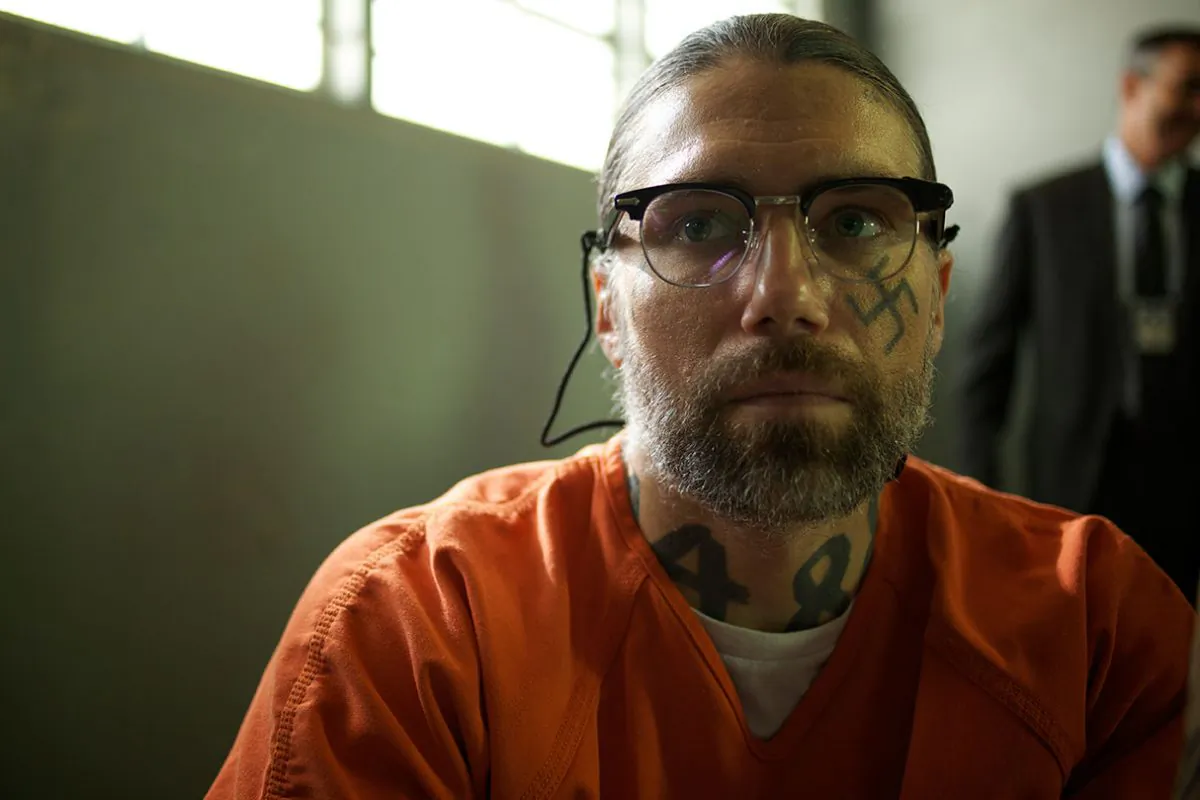Aryan Brotherhood leader Sobecki (Anson Mount) being interrogated in prison. (Well Go USA)