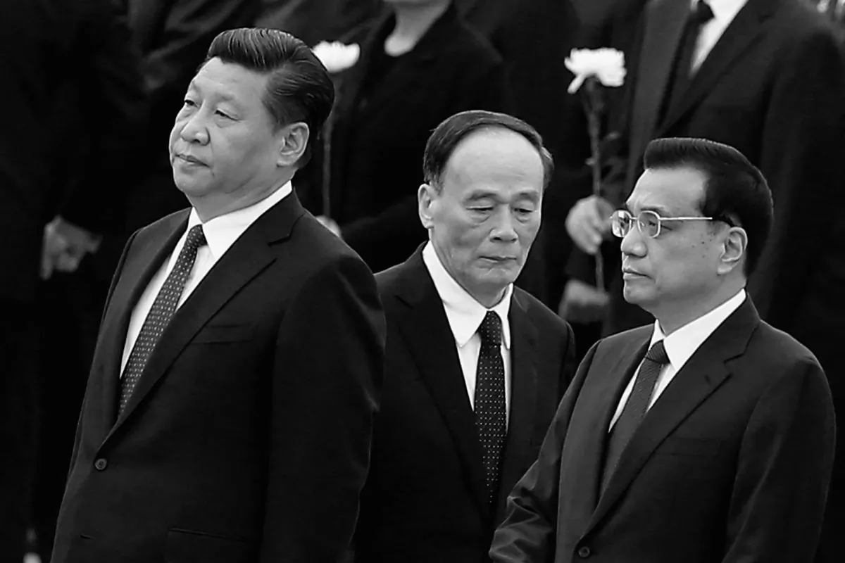 Communist Party general secretary Xi Jinping (L), Premier Li Keqiang (R), and disciplinary  agency boss Wang Qishan (C), in Beijing, on Sept. 30, 2014. Growing numbers of Chinese officials have perished of "unnatural causes," including suicide, since Xi Jinping took power in late 2012. (Feng Li/Getty Images)