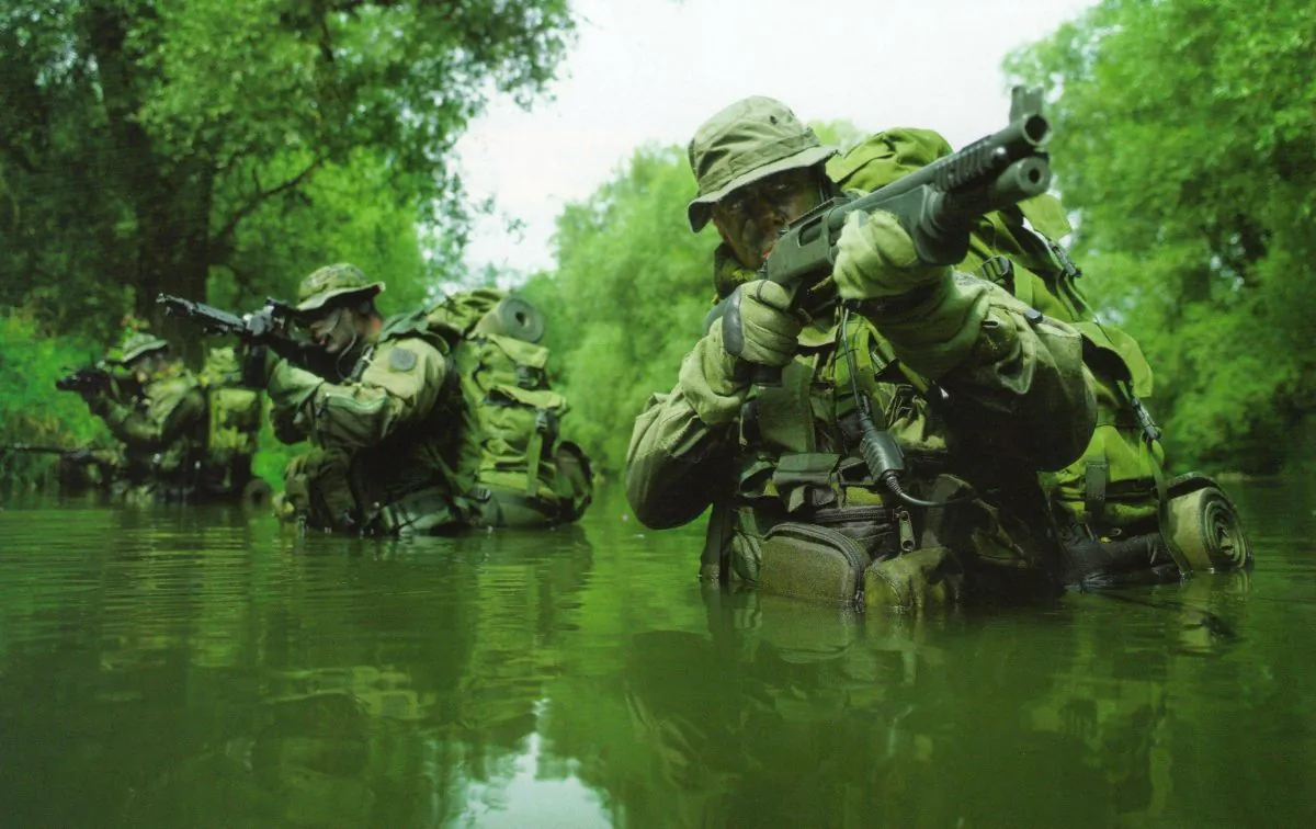 Soldiers screening swampy jungle area