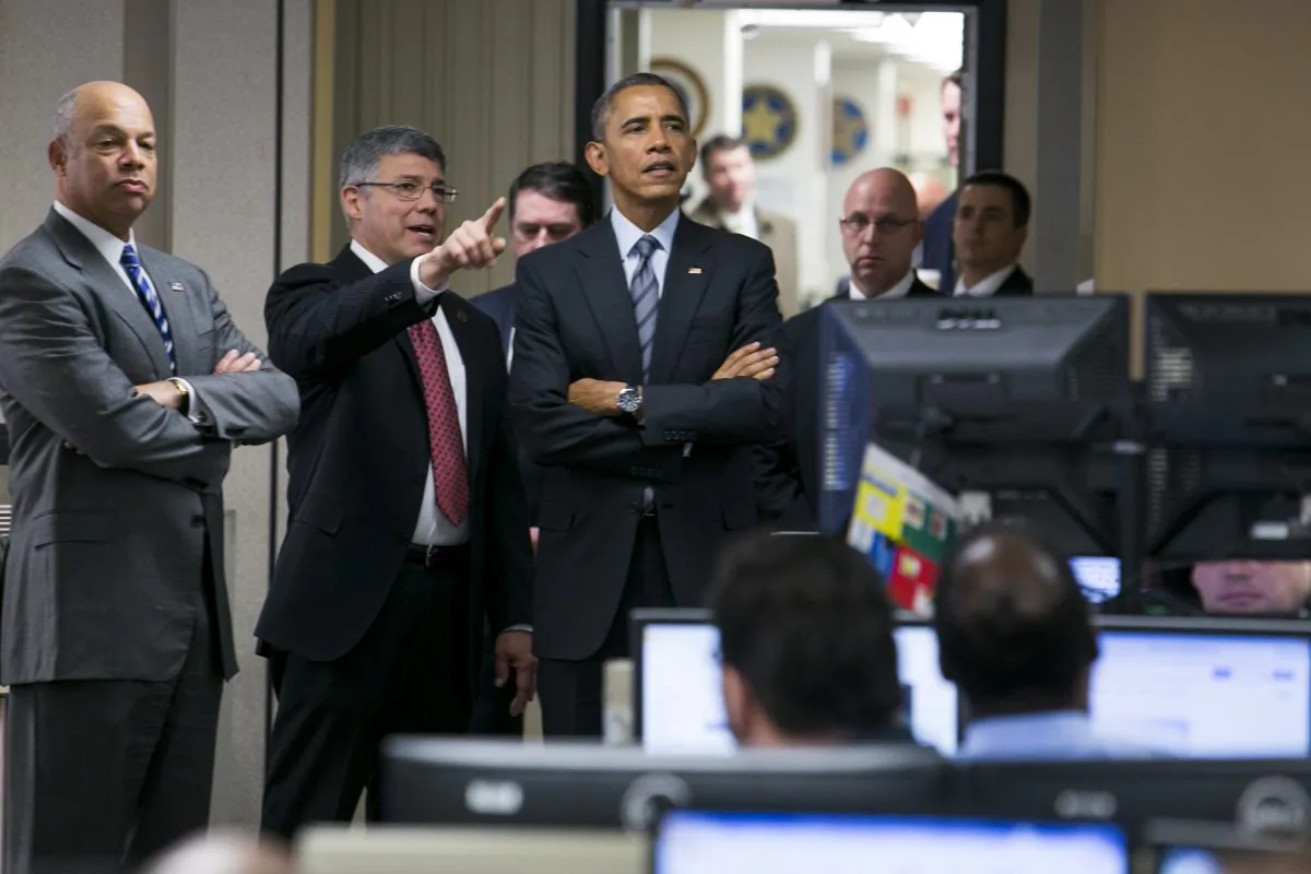 U.S. President Barack Obama is escorted by Jeh Johnson, Secretary Of Homeland Security, (L) and Richard M. Chavez, Director of Operations Coordination and Planning, (C) as he visits the National Operations Center (NOC) at the Department of Homeland Security in Washington, D.C., after speaking about the administration's fiscal year 2016 budget request released earlier in the day on Feb. 2, 2015. (Kristoffer Tripplaar-Pool/Getty Images)