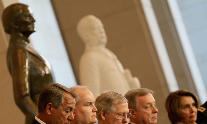 (L-R) House Speaker John Boehner (R-Ohio), Canadian Minister of Veterans Affairs Erin O’Toole, Senate Majority Leader Mitch McConnell (R-Ky.), Sen. Dick Durbin (D-Ill.), and House Minority Leader Nancy Pelosi (D-Calif.) participate in a medal ceremony on Capitol Hill on Feb. 3, 2015. (Mark Wilson/Getty Images)