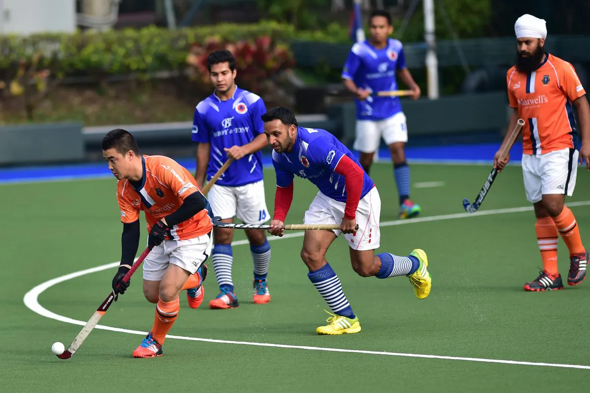 Khalsa-A’s Lu Peng did not have his usual success in setting up his forwards in this HKHA Premier division match against Punjab-A as many passes were intercepted by fast moving Pinjab player at King’s Park on Sunday Feb 1, 2015. (Bill Cox/Epoch Times)