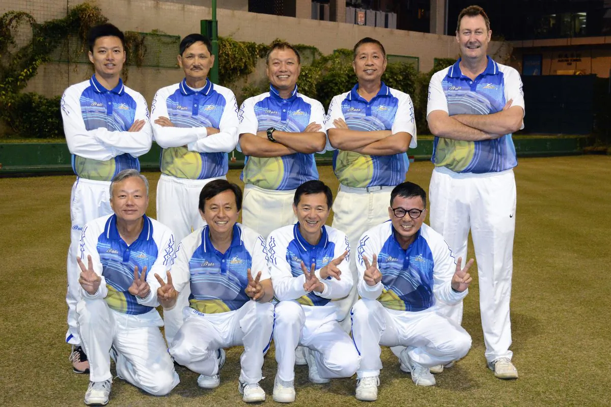 A jubilant Police team celebrates their first ever Triples League title, after defeating a strong Kowloon Bowling Green Club side away from home on Saturday Jan 31, 2015.(Stephanie Worth)
